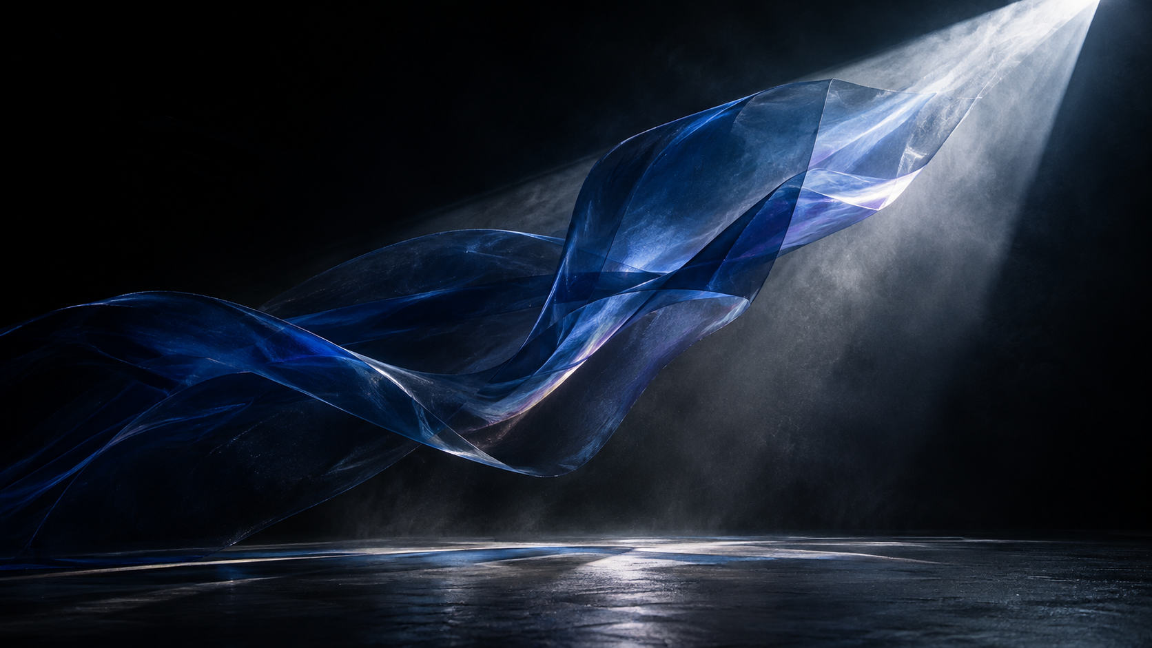 Translucent cobalt material moving through a beam of light